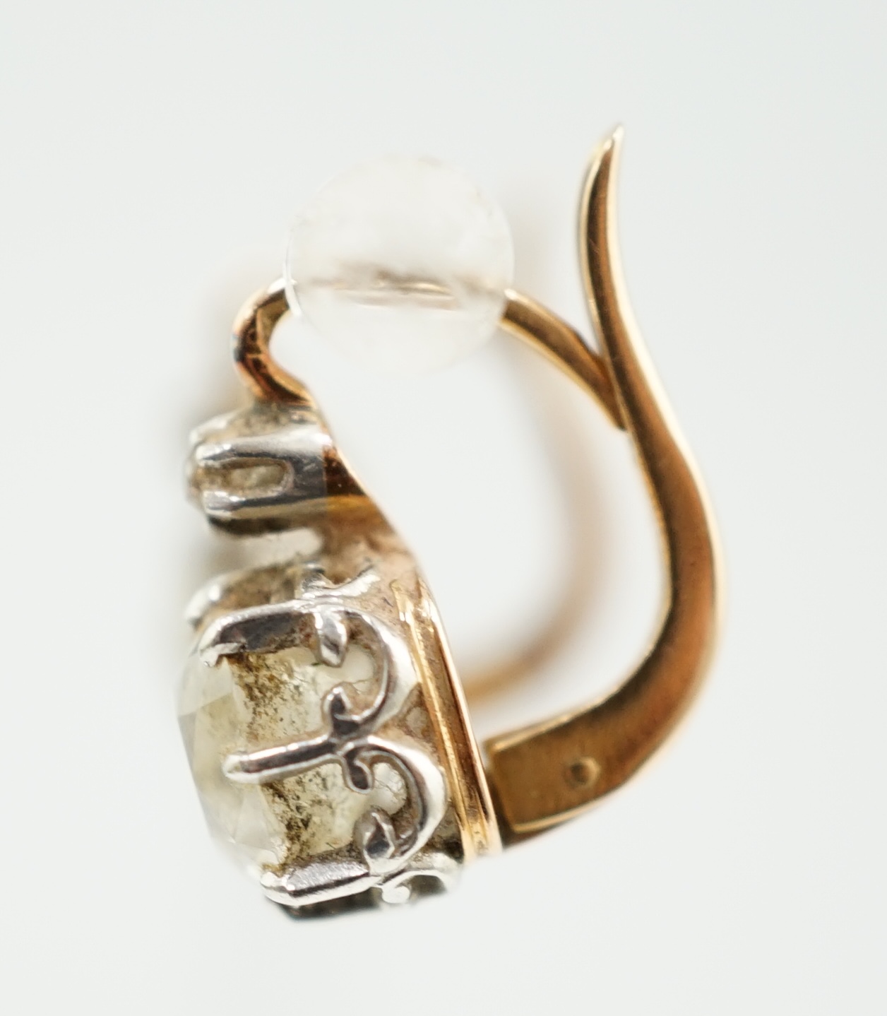 A pair of late 19th/early 20th century gold and two stone cushion cut diamond set earrings